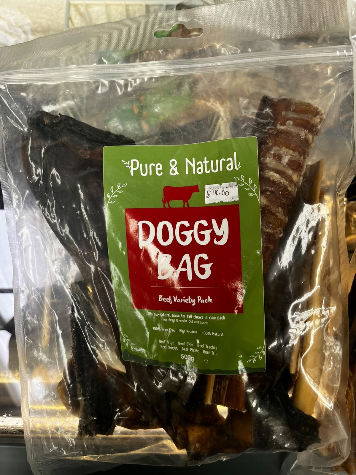 Pure & Natural Doggy Bag Beef Variety Pack 500g, a clear bag of beef chews with a green and red label.